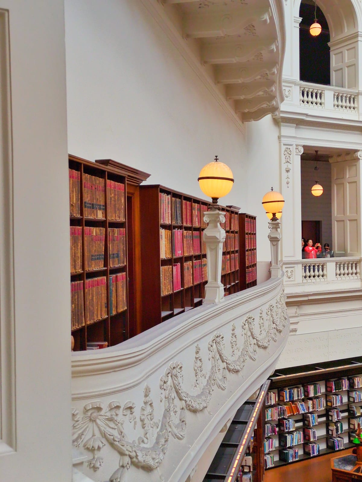 A balcony filled with bookshelves.